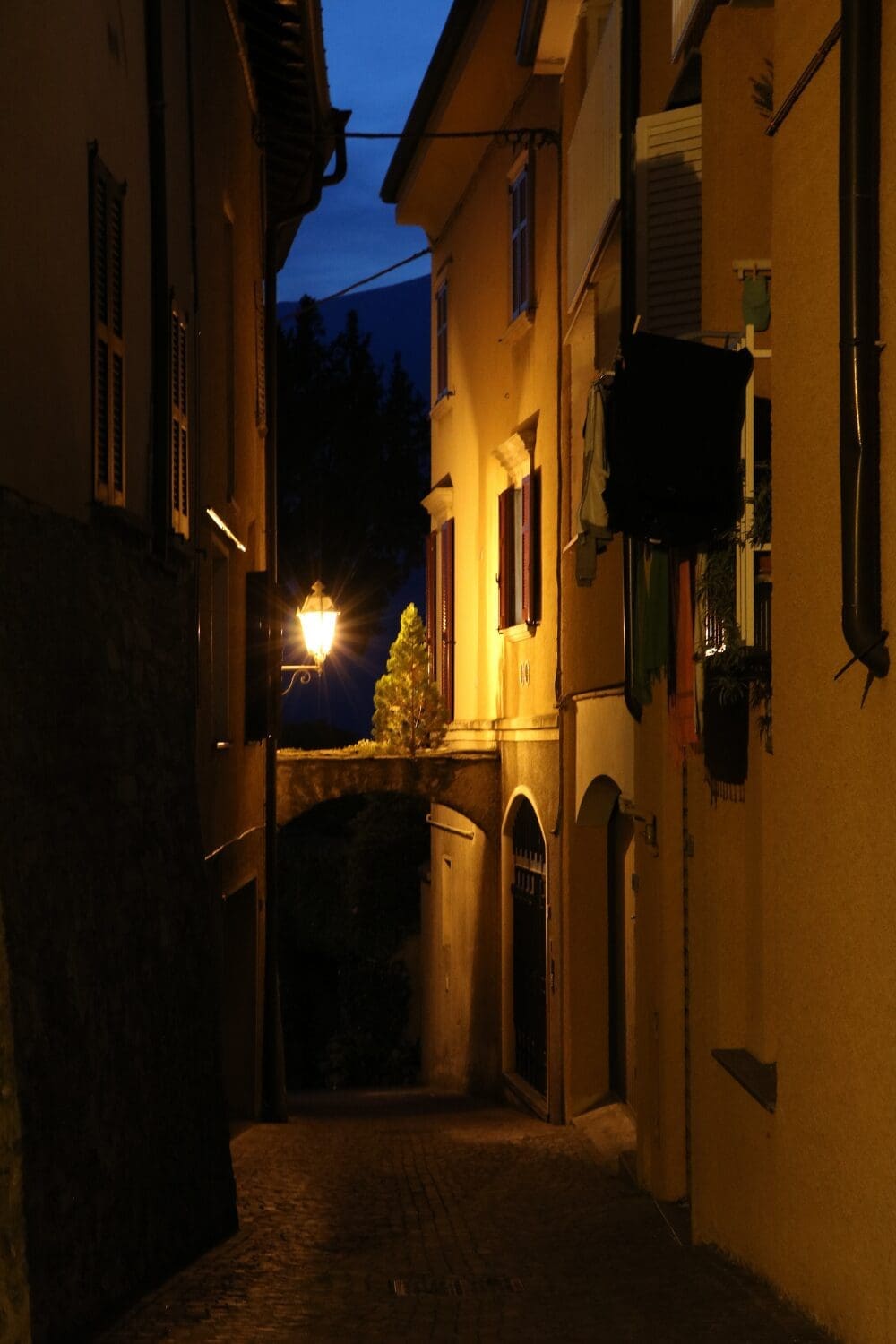 French village alley at dusk with golden light, Loire Valley France, Nightingale-inspired group trip